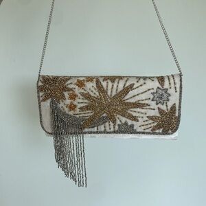 From St. Xavier Night Sky Foldover Clutch